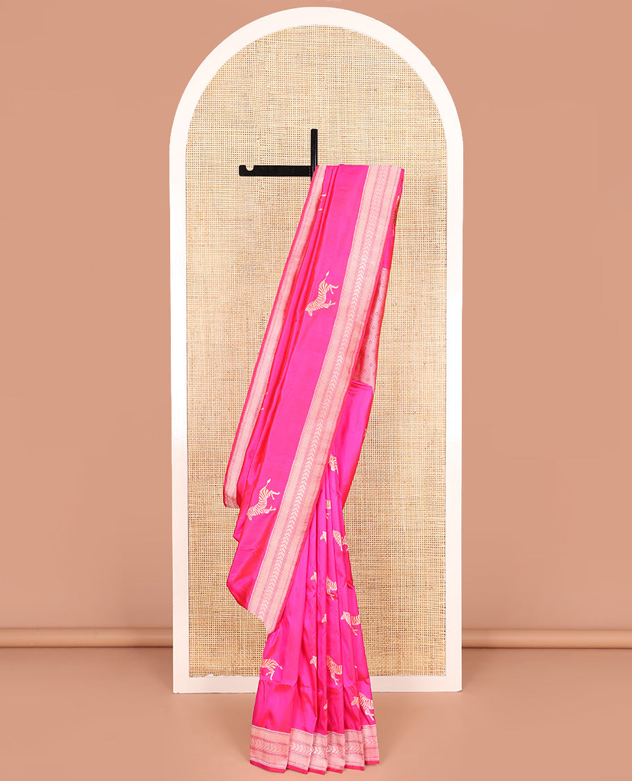 Pink Banarasi Silk Saree Accentuated with Zebra Motifs All Over Its Body, a Subtle Border of Traditional Designs, Pallu Decked Up with Floral and Diamond Designs, and Paired with a Matching Blouse