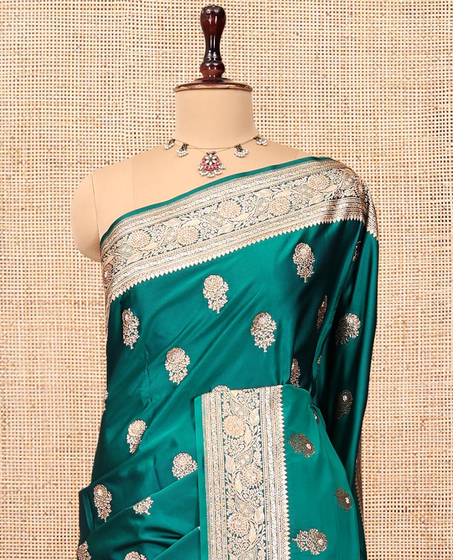 Green Banarasi Satin Saree, Bedecked with Floral Buttas, a Floral Creeper Border, Intricate Stonework Pallu, and a Matching Blouse