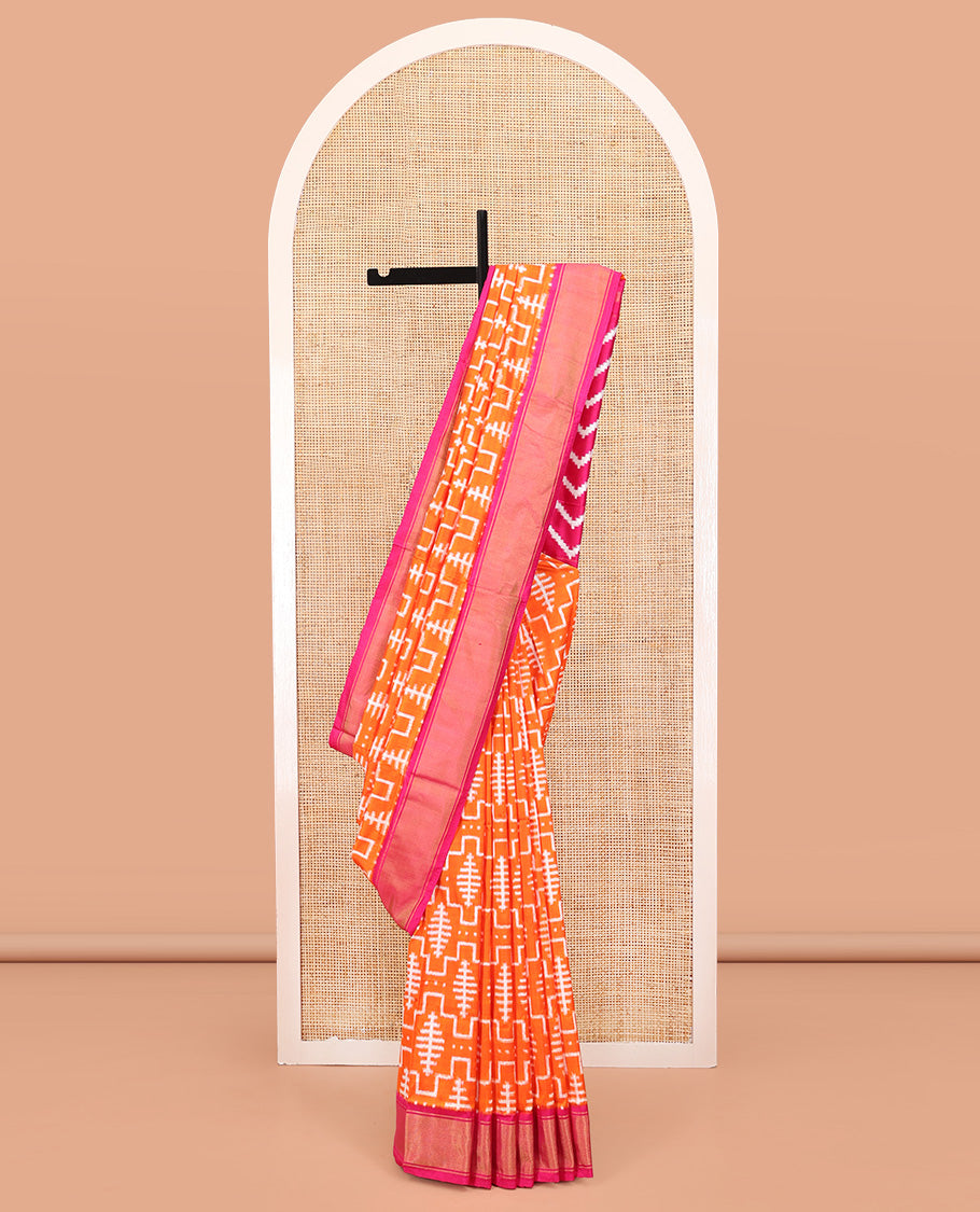 Orange Ikkat Silk Saree, Mesmerized with Ikkat-Style Geometric Patterns on Its Body, Complemented by a Contrast Border, Pallu Features Chevron Stripes, and Paired with a Contrast Blouse