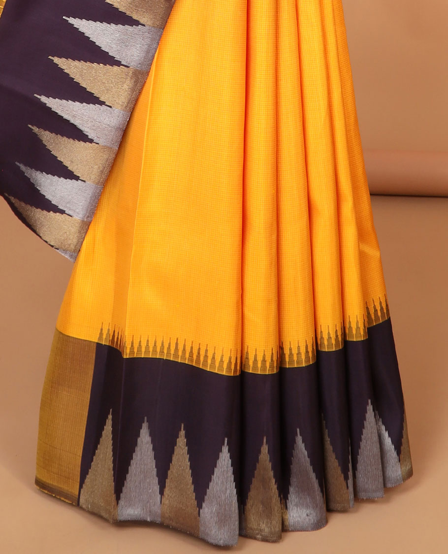 Yellow kancheepuram silk saree with contrast korvai temple border & bhavanji design pallu