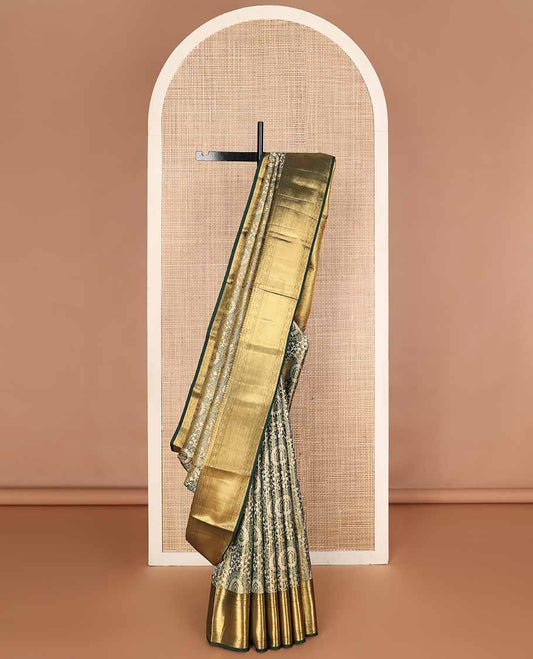 Green jacquard tissue silk saree, intricately designed pallu & zari border of manga mokku,neli kathir,kamalam & zari stripes