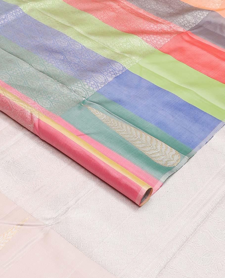 Cream and multi-color half-and-half ogee patterned Kanchipuram silk saree, zari border of big thilakam-shaped leaf buttas, and jaal pallu