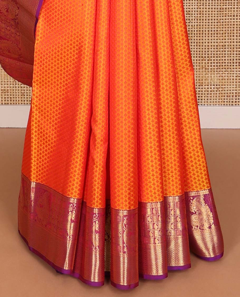 Orange floral design silk saree with contrast border of rekku, paun, mayil, manga, vanki design & floral design pallu