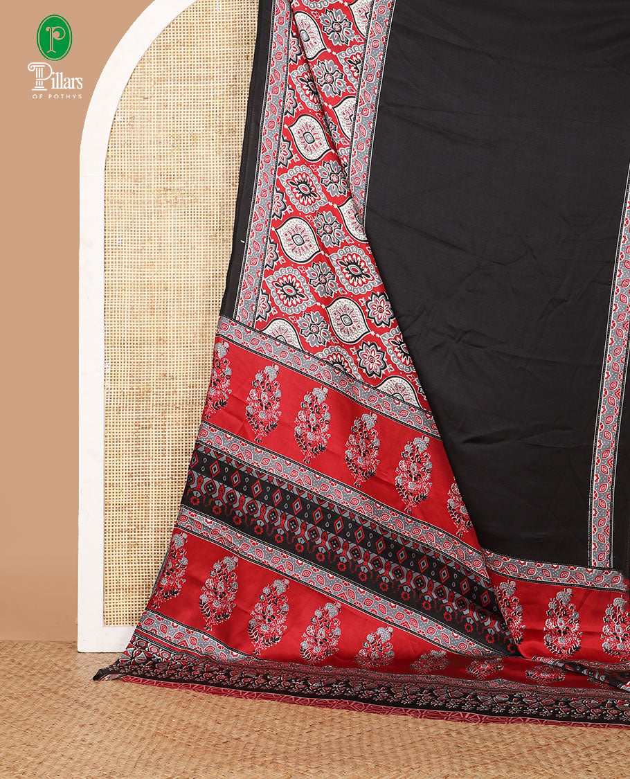 Black half-&-half style modal satin saree features floral & geometric design Ajrakh printed contrast border & pallu