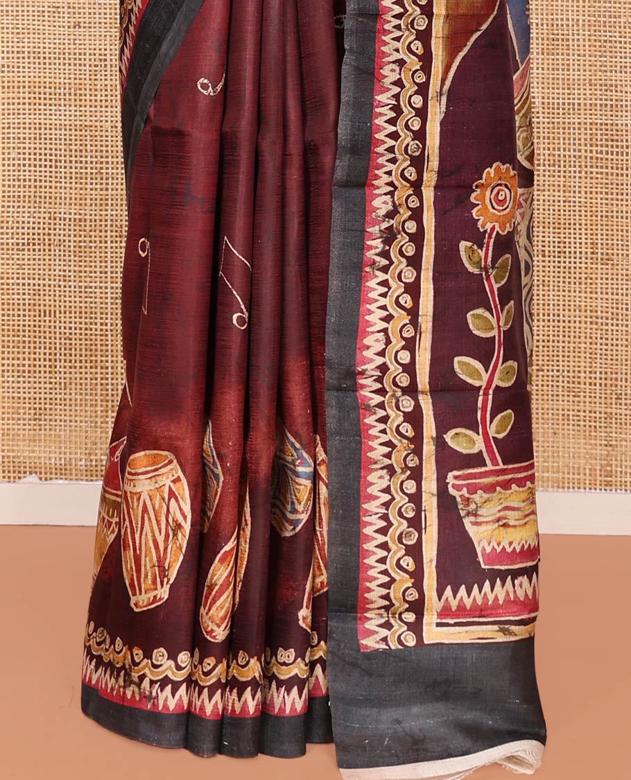 Maroon Printed Silk Saree Featuring Music Note Motifs and Musical Instruments Print, Complemented with a Contrast Temple-Printed Border, Pallu Picturing a Dancing Girl Motif Print, and Paired with a Matching Blouse