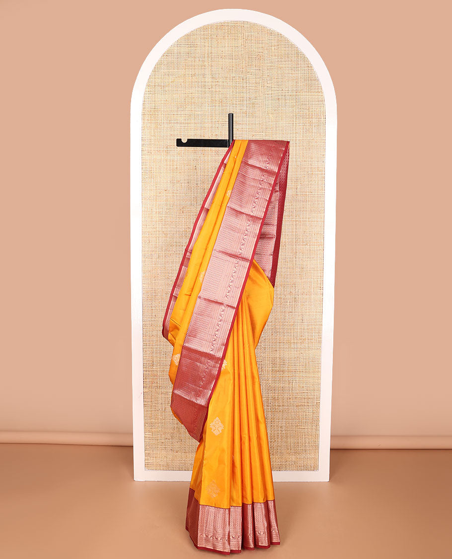Orange buttas silk saree with contrast border of thilakam mokku, muthu, banaras design & jaal pallu