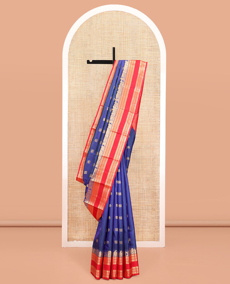 Blue Vasundhara Silk Saree, Dazzled with Mayil and Yaanai Buttas All Over Its Body, Complemented by Contrast Border of Wedding-Theme Motifs, Ara Bogudi, Muthu, and Ara Maadam Designs, Grand Jaal Pallu, and Paired with a Contrast Blouse