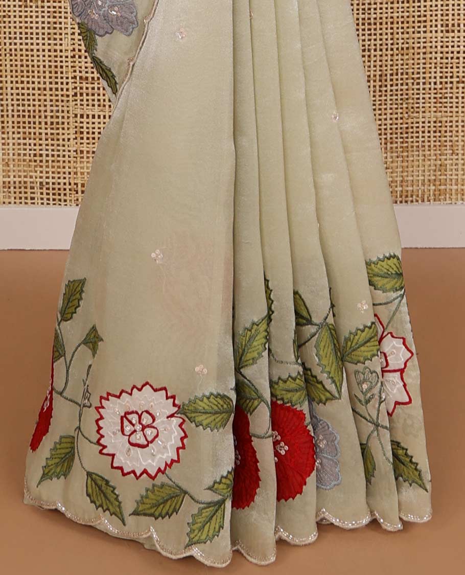 Cream all-over sequins embroidery tissue saree with floral , sequins embroidery scallop border