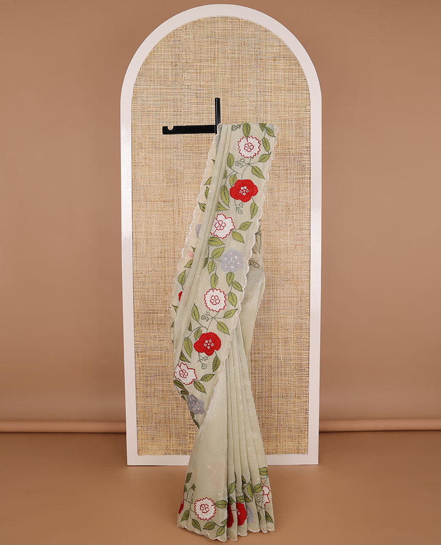 Cream all-over sequins embroidery tissue saree with floral , sequins embroidery scallop border