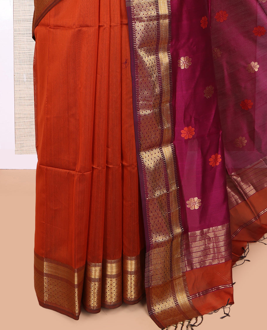 Orange Maheshwari Cotton Saree, Adorned with Buttas, Complemented by a Contrast Traditional Zari Border, Pallu Gleamed Up with Zari Buttas, and a Contrast Blouse