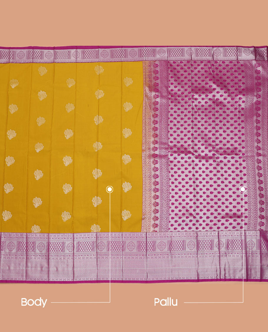Mustard Budget Silk Saree, Graced with Buttas All Over Its Body, Complemented by a Contrast Traditional Zari Design Rettai Pettu Border, Pallu Steeped with Floral Designs, and Paired with a Contrast Blouse