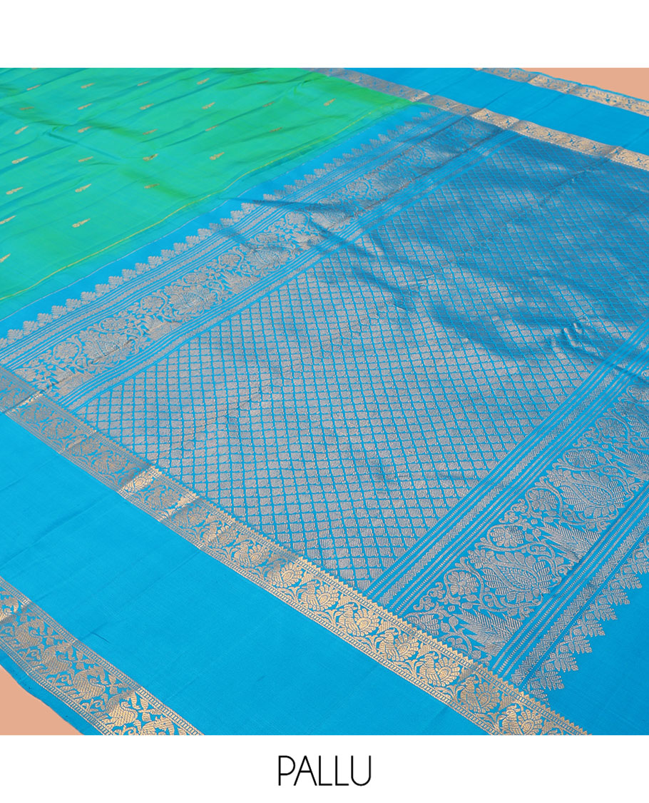 Green Kanchipuram Silk Saree, Ornamented with Zari Buttas, Complemented by Contrast Rettai Pettu Border of Rekku, Muthu, and Mayil Designs, Jaal Pallu, and Contrast Blouse