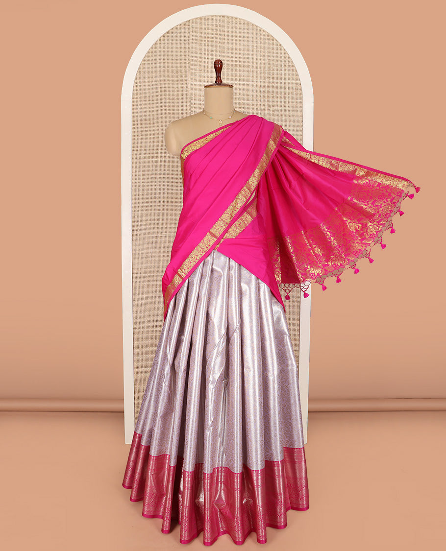 Grey Art Silk Material Half Saree Set Featuring Floral Jacquard Skirt, a Contrast Traditional Zari Design Border, a Zari-Jacquard Blouse, and a Dhavani Adorned with Floral Zari Designs