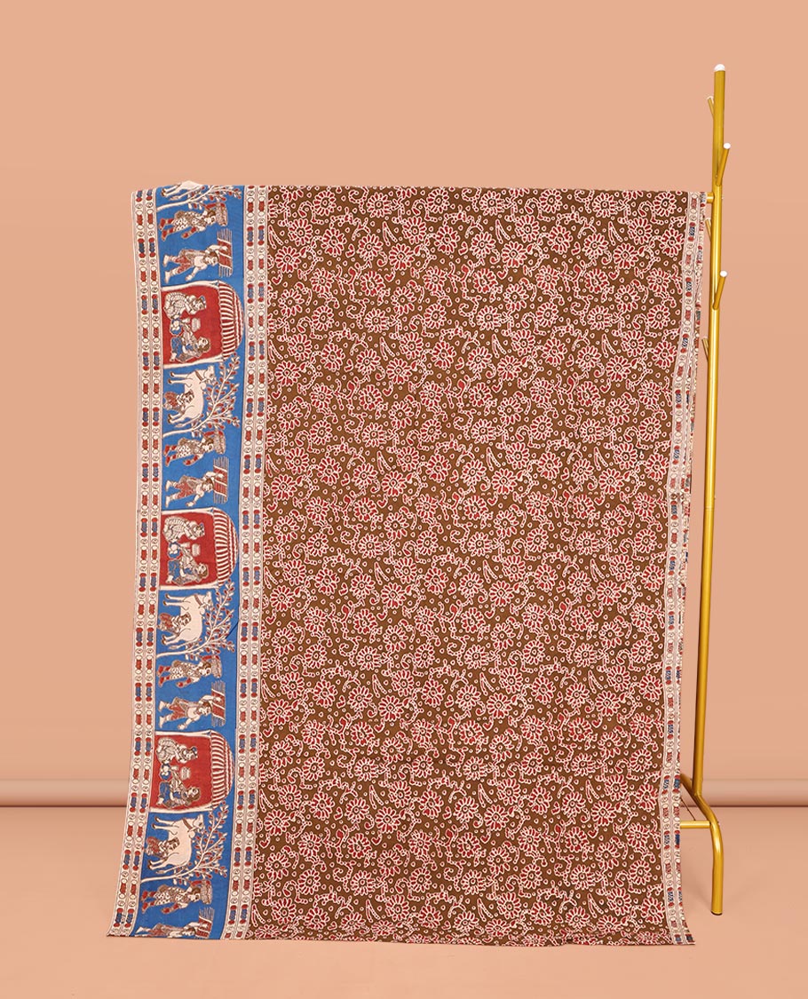 Brown Machine-Printed Kalamkari Cotton Saree, Accentuated with Floral Motifs on Its Body, Complemented by a Contrast Village-Theme Printed Border, Pallu of Peacock Motifs Print, and Paired with a Printed Blouse