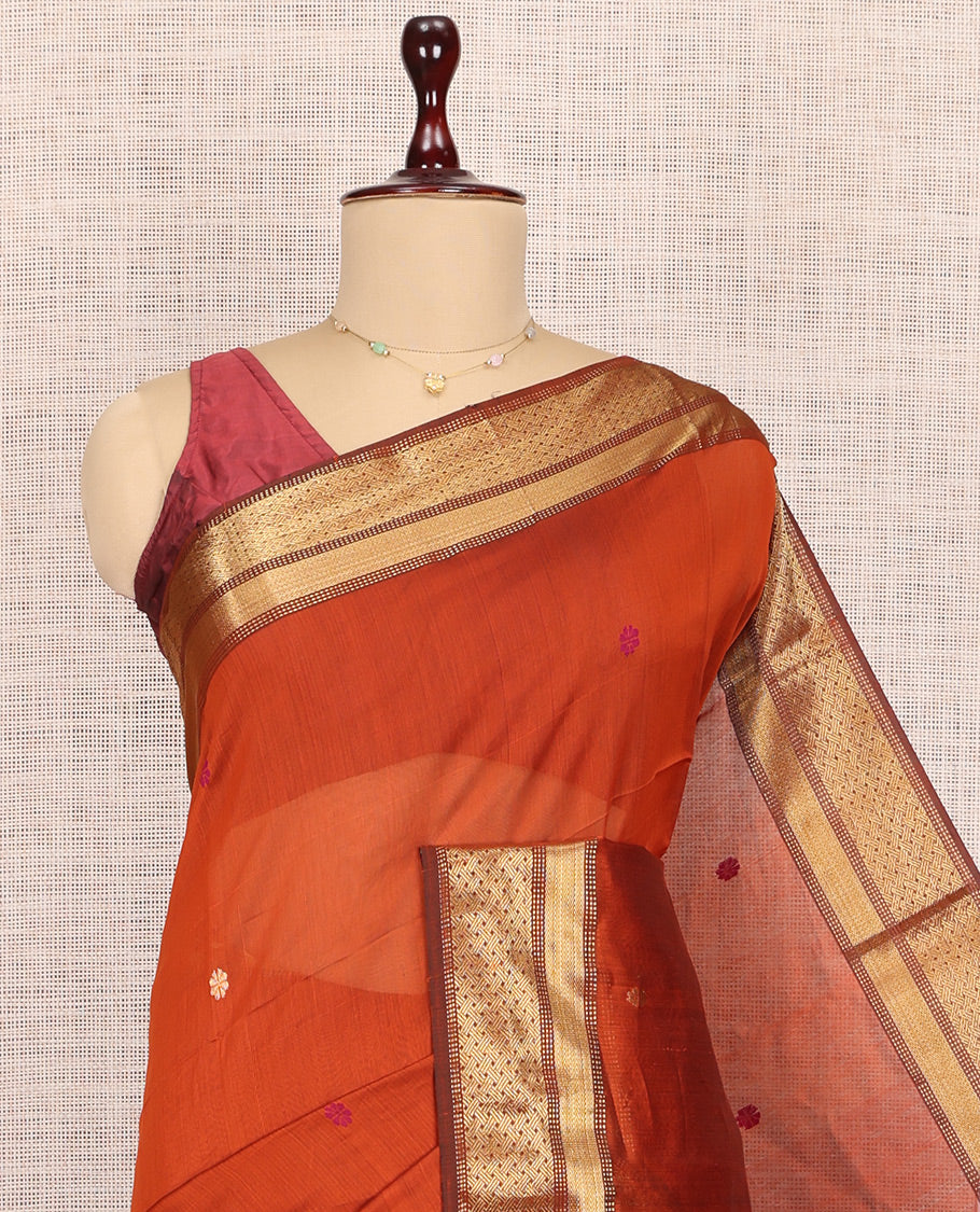 Orange Maheshwari Cotton Saree, Adorned with Buttas, Complemented by a Contrast Traditional Zari Border, Pallu Gleamed Up with Zari Buttas, and a Contrast Blouse