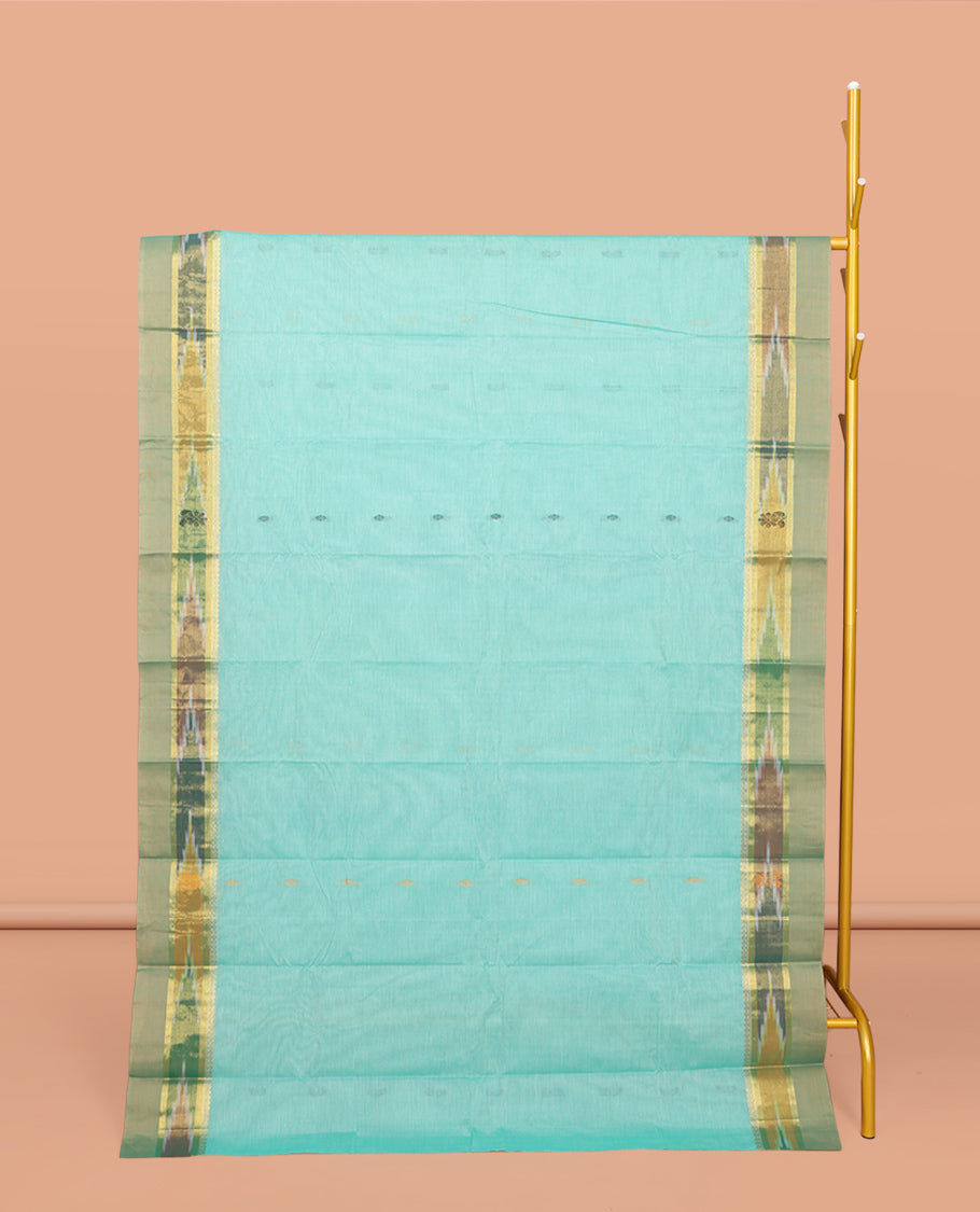 Turquoise Kanchi Cotton Saree, Showcasing Buttas All Over Its Body, Complemented by a Contrast Ikkat Border, Pallu of Floral Design, and Paired with a Matching Blouse