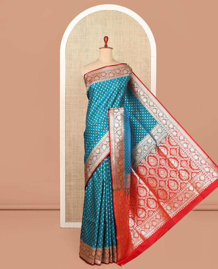 Blue Semi-Banaras Saree, Boldly Accentuated with Buttas on Its Body, Complemented by a Contrast Floral Creeper Design Border, Intricately Designed Pallu, and Paired with a Contrast Blouse