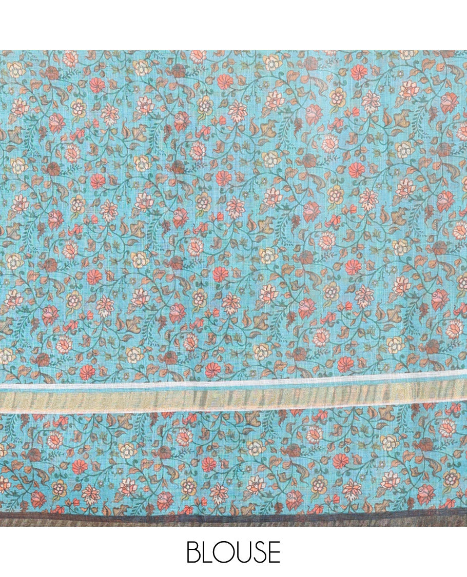 Blue Linen Saree Accentuated with Leaf Motifs All Over Its Body, Complemented by a Contrast Floral Vine Printed Border, Pallu Mirrors the Floral Vine Print, and Paired with a Contrast Floral Printed Blouse