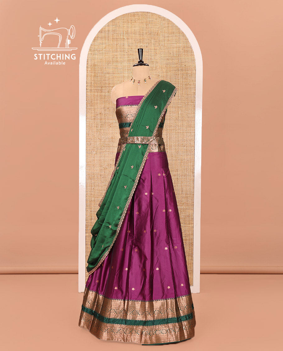 Purple and Green Semi-Banarasi Half-Saree Featuring Zari Buttas Skirt, Complemented by Contrast Rettai Pettu, Traditional Border of Floral Creeper Designs, Paired with a Matching Blouse, and a Satin Georgette Embroidered Scallop Dhavani