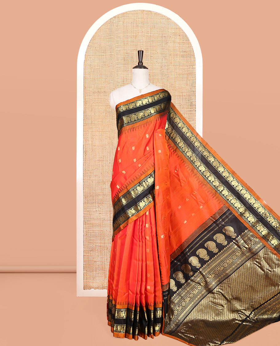Orange Gadwal Silk Saree, Embellished with Peacock Buttas, Complemented by a Contrast Peacock Motifs Woven Temple Border, Grand Jaal Pallu, and a Contrast Blouse