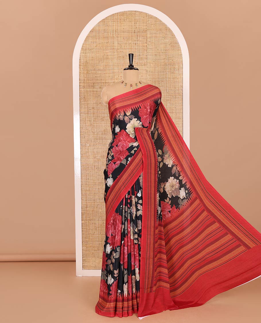 Black floral printed Italian crepe saree, contrast temple printed border, striped pallu, and a printed bordered blouse