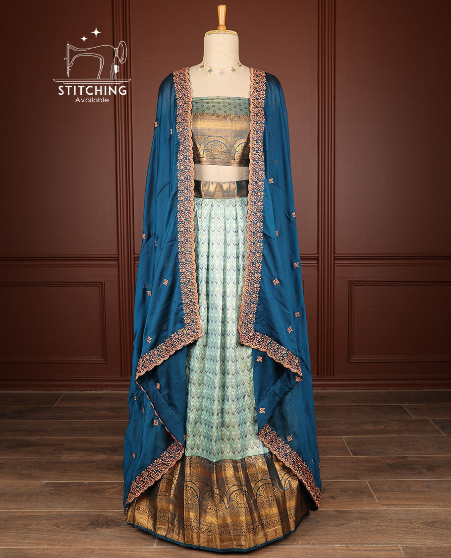 light blue geometric design half saree with contrast intricate zari design border, zari design blouse & floral embroidery dhavani