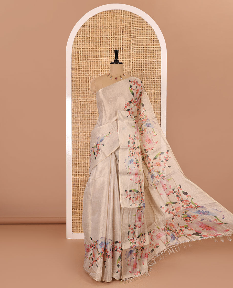 Cream plain tissue saree with hand painting style floral motifs printed border, and pallu and a printed blouse