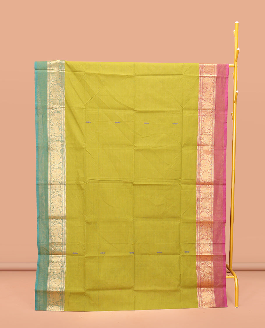 Parrot Green Chettinad Cotton Saree, Woven with Buttas All Over Its Body, Complemented by a Contrast Ganga-Jamuna Kal Eragina Border of Kodi Peacock and Elephant Designs, Pallu of Buttas and Stripes, and Paired with a Matching Blouse