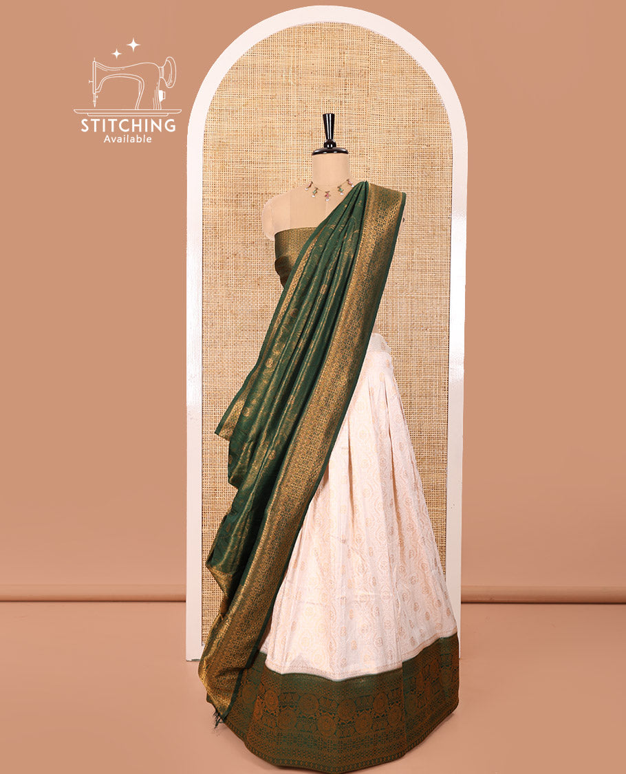 Cream and Green Banaras Softy Half-Saree Featuring Jacquard Design All Over the Skirt, Adorned with a Contrast Geometric Zari Design Border, Paired with a Jacquard Blouse, and a Banaras Softy Dhavani with Floral Jaal Jacquard Design
