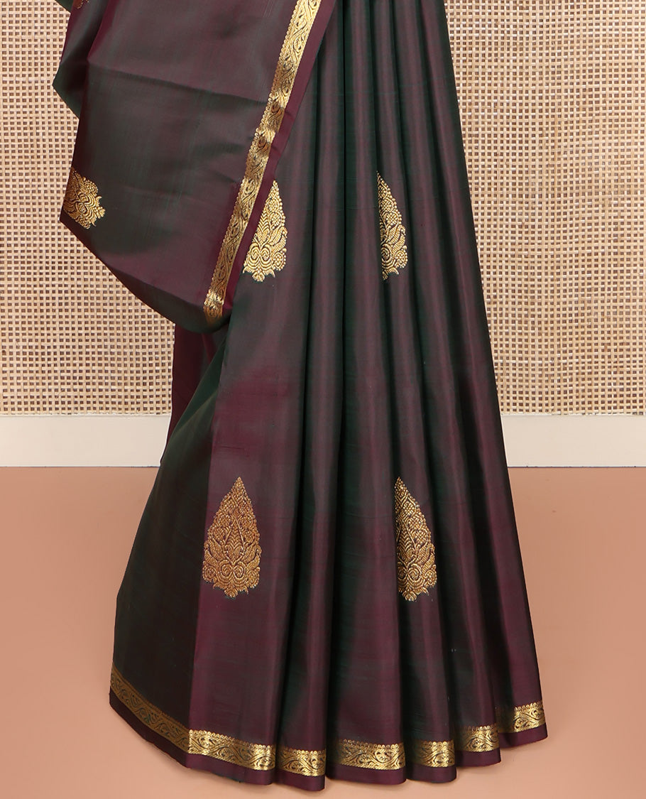 Brown Kanchipuram Silk Saree, Elevated with Zari Buttas All Over Its Body, Highlighted by Zari Piping Border, Grand Scallop Design Pallu, and Paired with a Matching Blouse