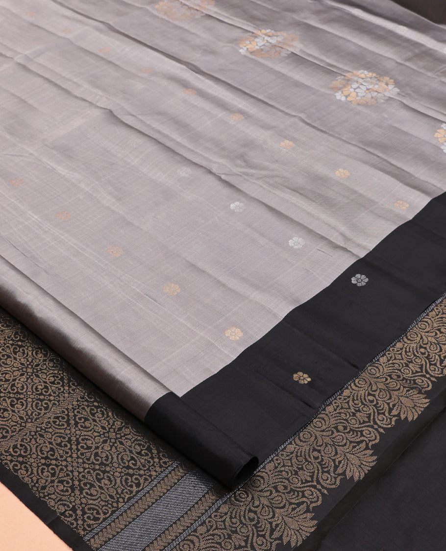 Grey Mayuri Lite Silk Mix Saree, Woven with Zari Buttas, Complemented By Contrast Border of Floral Buttas, a Grand Pallu, and a Contrast Blouse