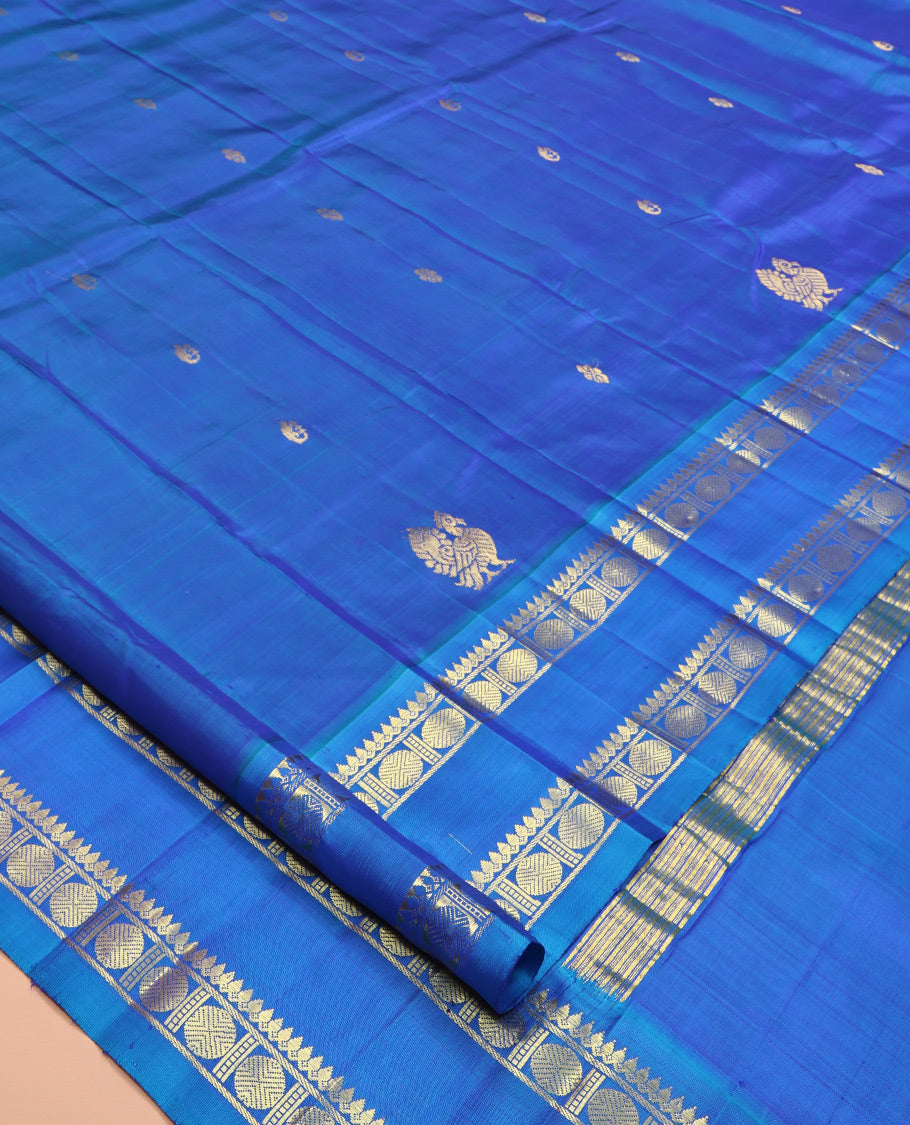 Blue Kanchipuram Silk Saree Features Zari Buttas, a One-Sided Rettai Pettu Border of Thilakam Mokku, and Rudraksham Designs, Zari Design Pallu, and No Blouse