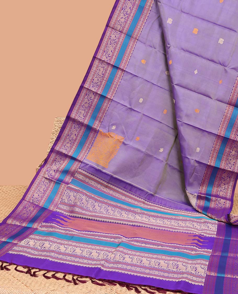 Violet buttas kancheepuram silk saree with contrast border of intricate zari design & traditional zari design pallu
