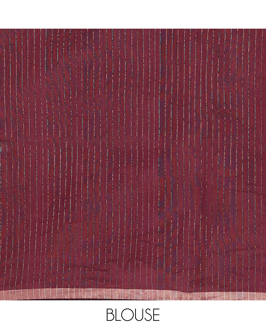 Wine sparsely striped saree, gleaming zari border features polka dots, and pallu steeped with polka dots