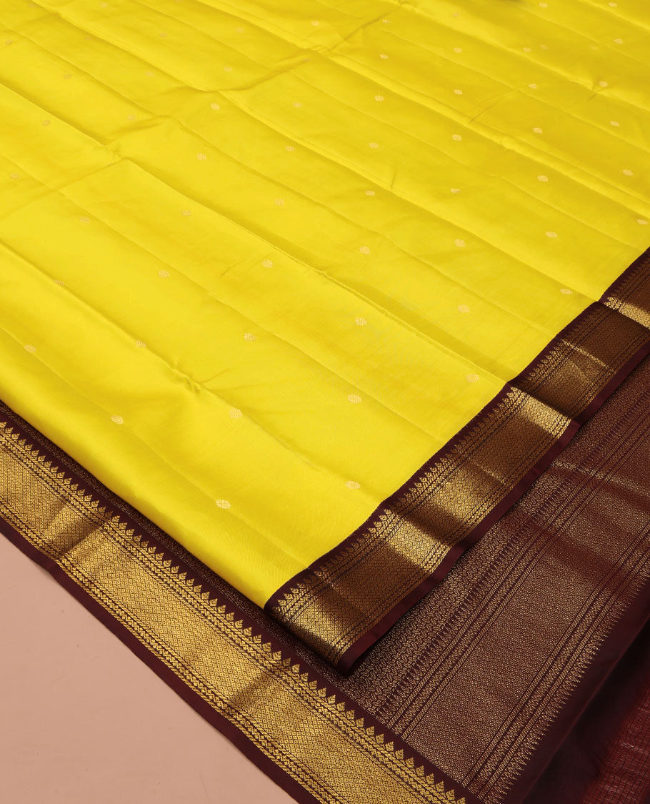 Yellow Vasundhara Silk Saree, Woven with Zari Buttas All Over Its Body, Complemented by a Contrast Korvai Border of Thilakam, Banaras, Neli, and Mayil Kann Designs, Grand Pallu, and Paired with a Contrast Blouse