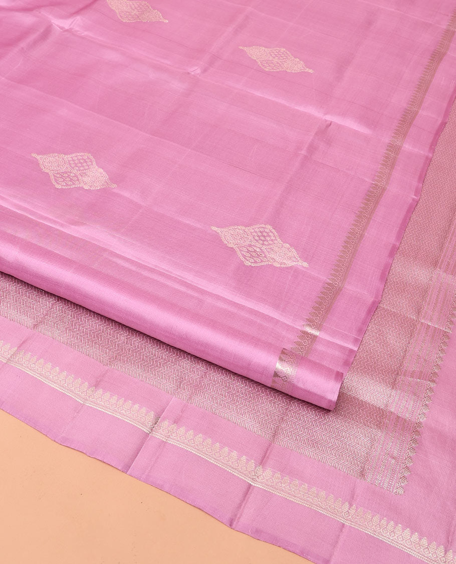 Pink Mayuri Soft Silk Saree, Embellished with Buttas All Over Its Body, Subtly Sparkled Kal Erangina Border of Thilakam Mokku Designs, Intricately Woven Pallu of Chevron Designs, and Paired with a Matching Blouse