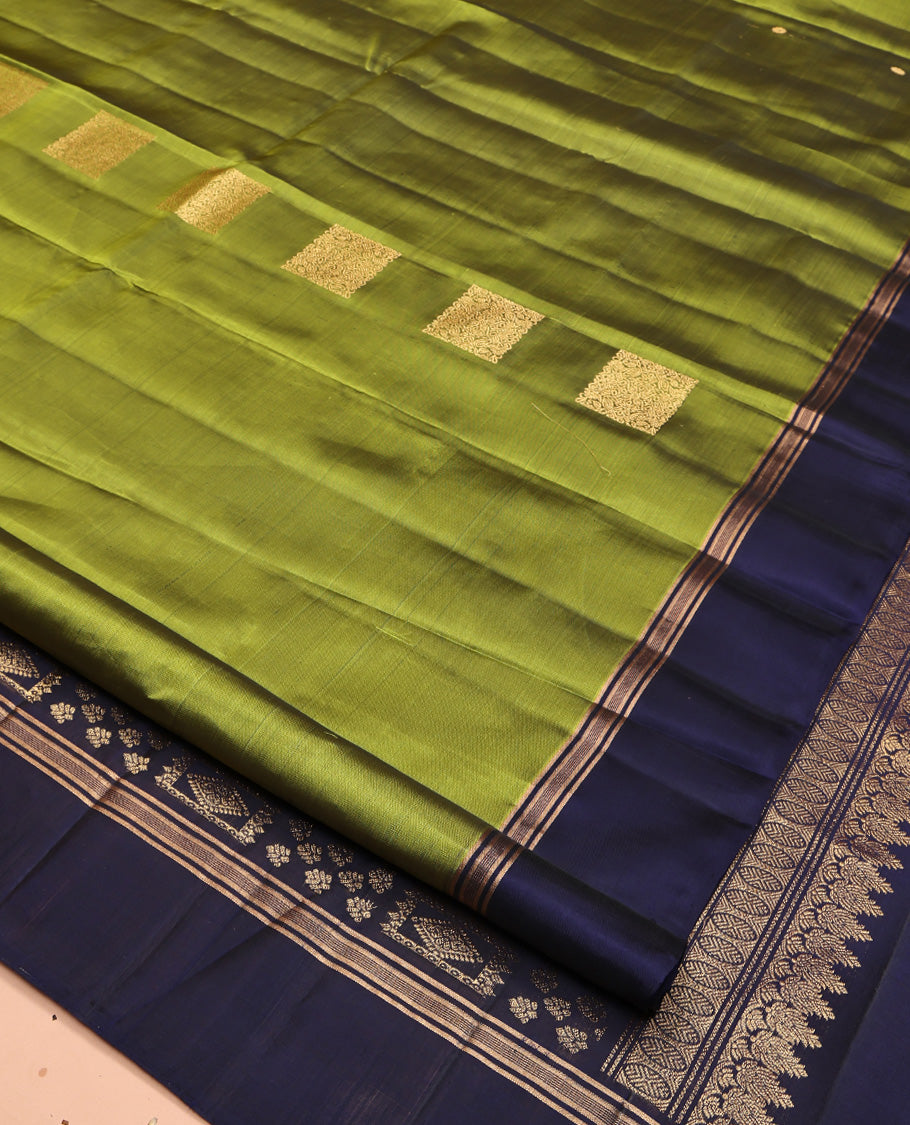 Green Mayuri Lite Silk Mix Saree, Gleamed Up with Square Buttas All Over Its Body, Complemented by Contrast Border, Intricately Designed Pallu, and Paired with a Contrast Blouse