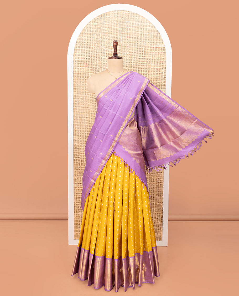 Yellow Pure Silk Half-Saree, Artfully Detailed with Mayil-Chakram Buttas on Its Skirt, Complemented by a Contrast Border of Rekku, Muthu, Diamond, Chakram, and Jaal Designs, Comes with a Contrast Blouse and a Dhavani of Jacquard Design