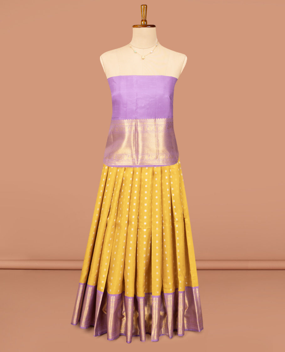 Yellow Pure Silk Half-Saree, Artfully Detailed with Mayil-Chakram Buttas on Its Skirt, Complemented by a Contrast Border of Rekku, Muthu, Diamond, Chakram, and Jaal Designs, Comes with a Contrast Blouse and a Dhavani of Jacquard Design