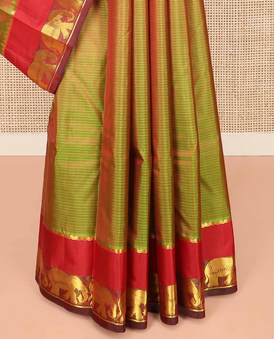 Green Dual-Toned Vazhaipoo Striped Kanchipuram Silk Saree, Complemented by Contrast Rettai Pettu Border of Thilakam Mokku, and Yaanai Designs, Pallu Subtly Woven in Stripes, and Paired with a Contrast Blouse