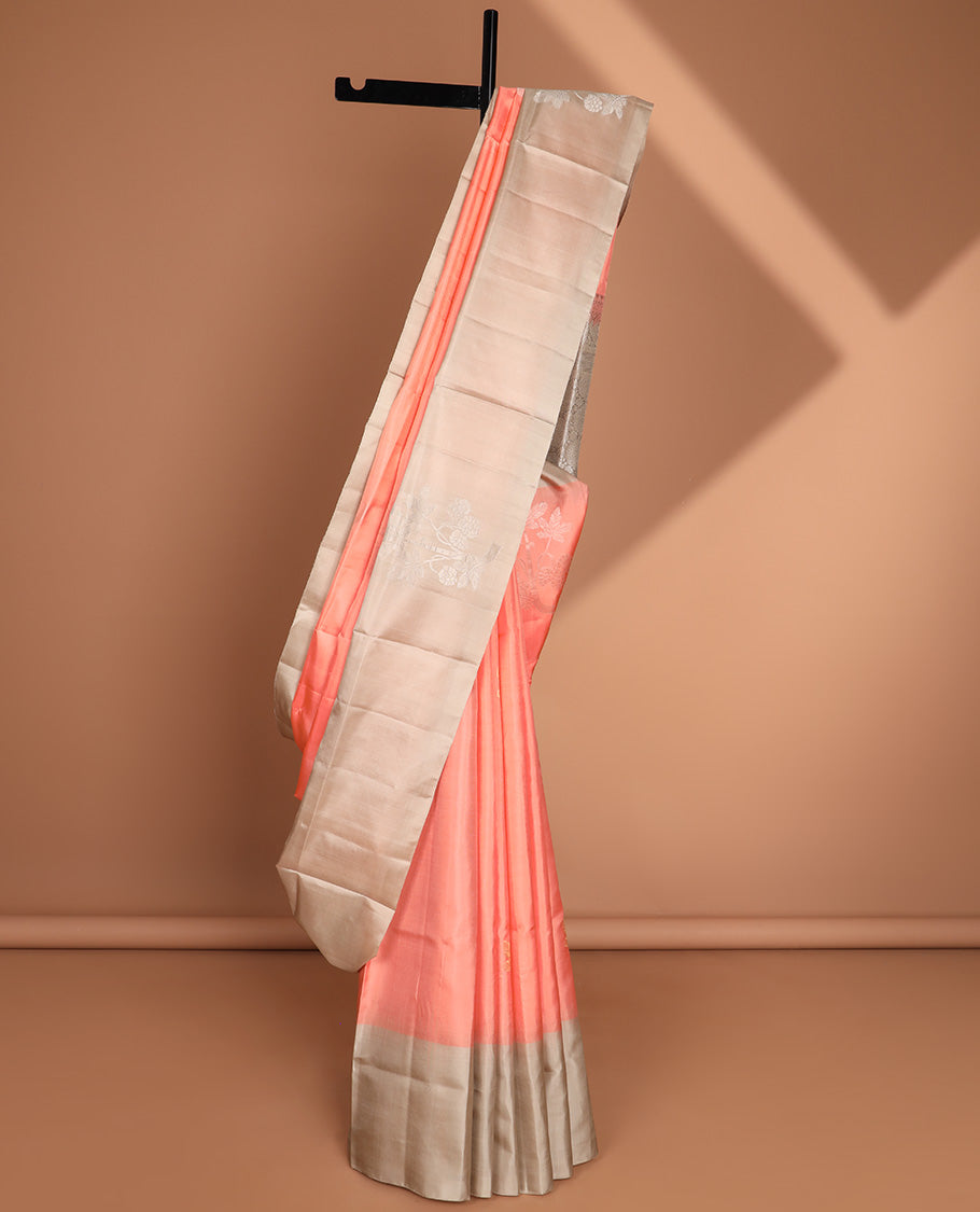 Peach floral buttas soft silk saree with contrast floral border & round buttas pallu