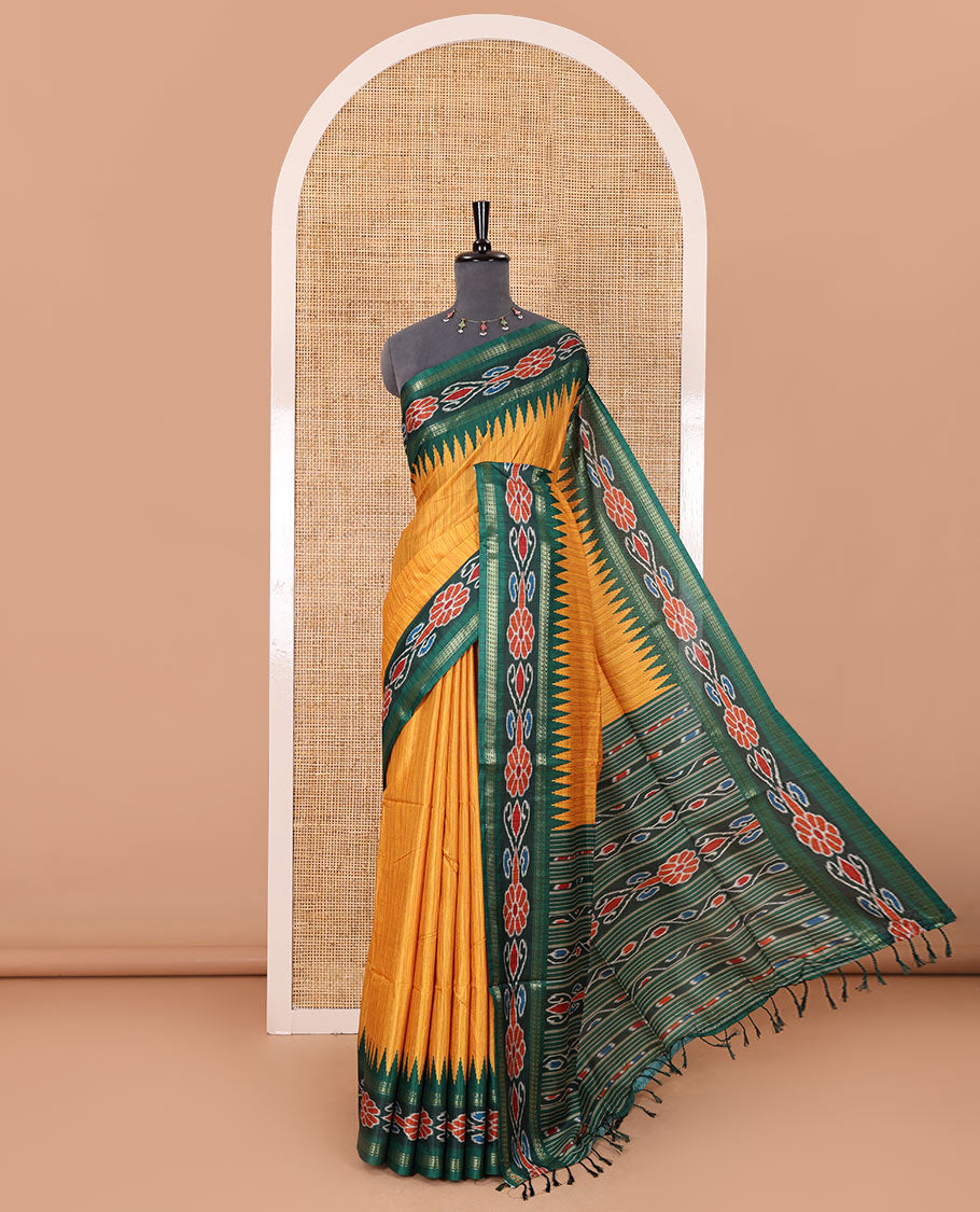 Yellow plain Katan silk saree, contrast temple ikkat floral printed border, ikkat floral printed pallu, and ikkat printed blouse