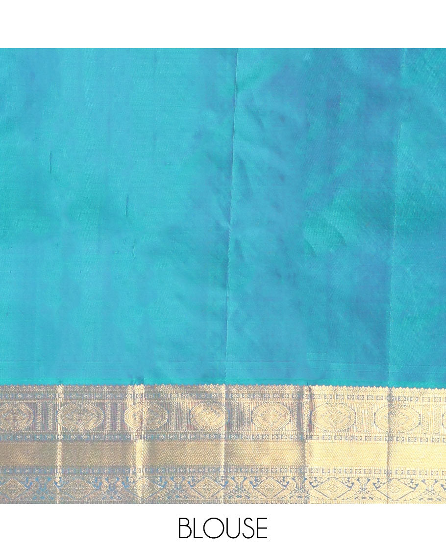 Blue Kanchipuram Wedding Silk Saree, Masterfully Woven with Jacquard Design on Its Body, Highlighted by a Zari Border of Thilakam, Chakram, Diamond, and Mayil Designs, Majestically Detailed Pallu, and Paired with a Matching Blouse