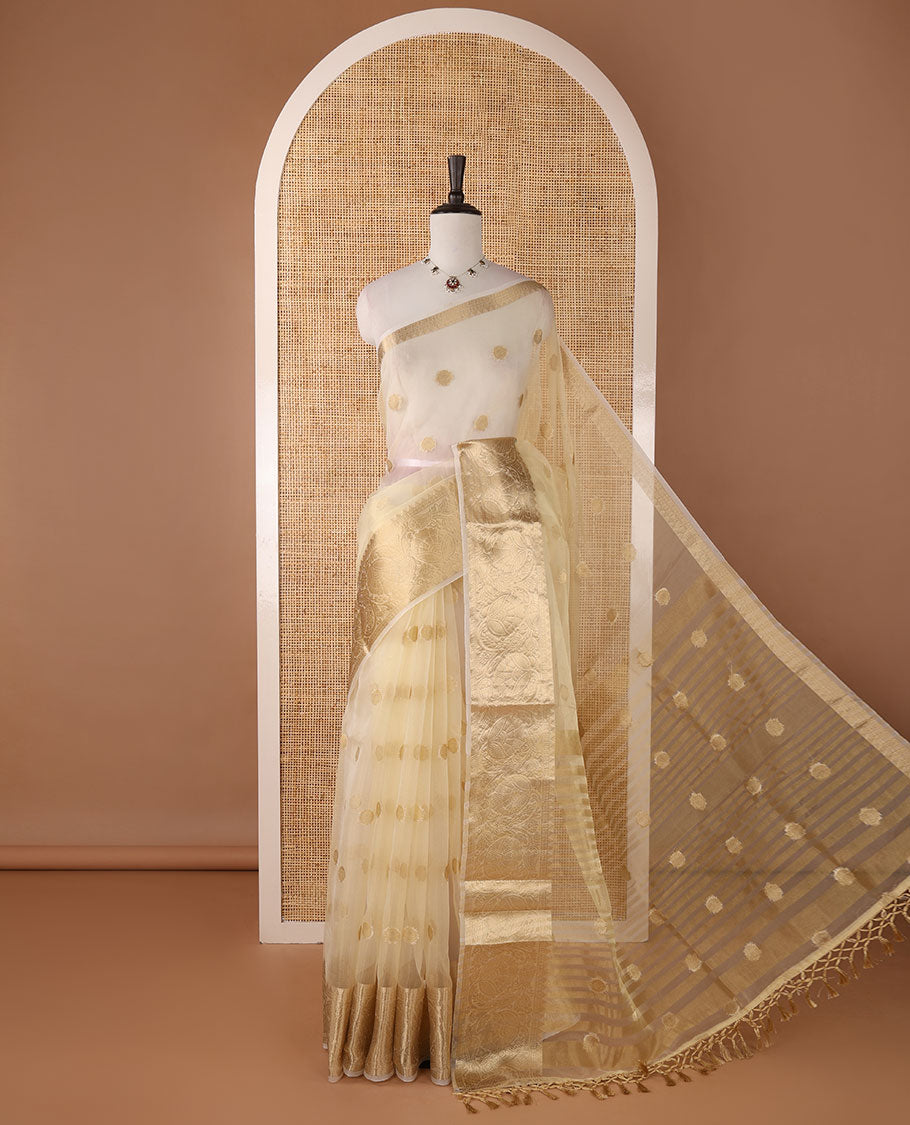 Cream semi-organza saree with zari buttas, zari border of temple & floral creeper designs, zari design pallu & running blouse