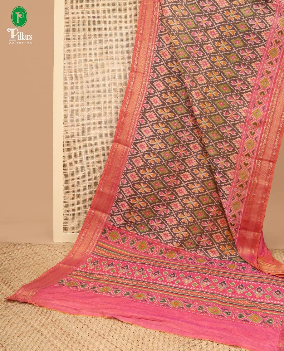 Brown with pink pochampalli printed design semi patola silk saree, contrast gold zari jacquard border & printed rich pallu along with plain blouse
