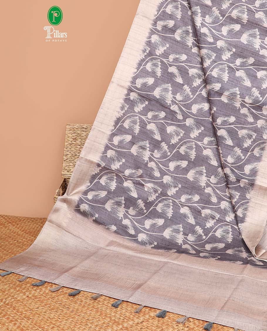 Elephant grey with cream all-over printed design semi khicha tussar saree with gold zari jacquard border & purejute weaving pallu along with plain blouse