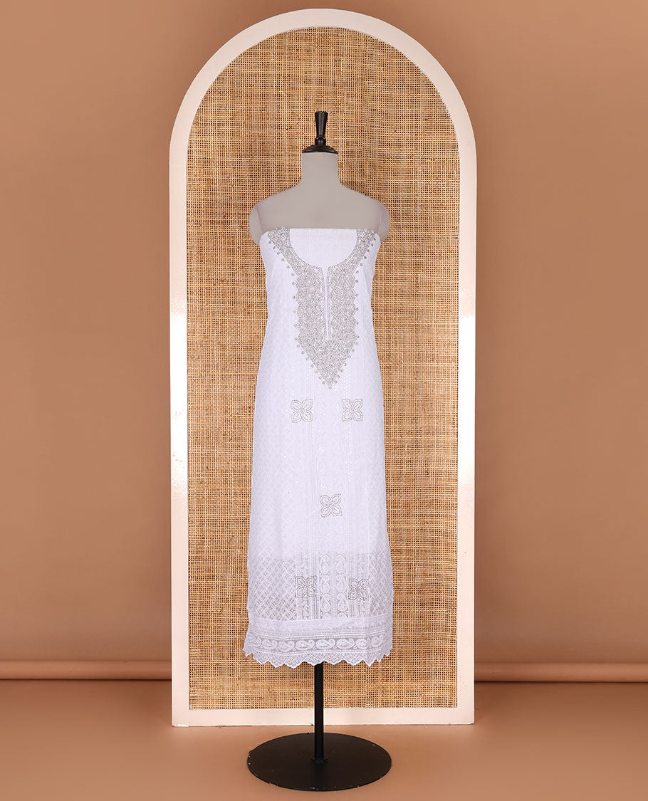 White material churidar set, stone work with Schiffli style embroidered georgette top, American Crape bottom, and polka dotted printed mirror work dupatta