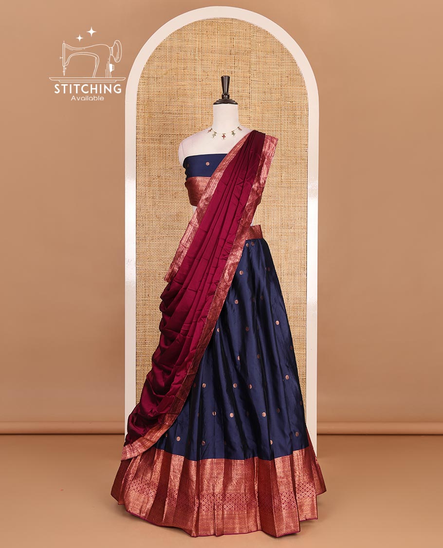 Navy blue taffeta silk half saree, floral zari buttas with contrast maroon traditional zari border skirt, matching zari design blouse, and contrast plain zari border syska georgette dhavani