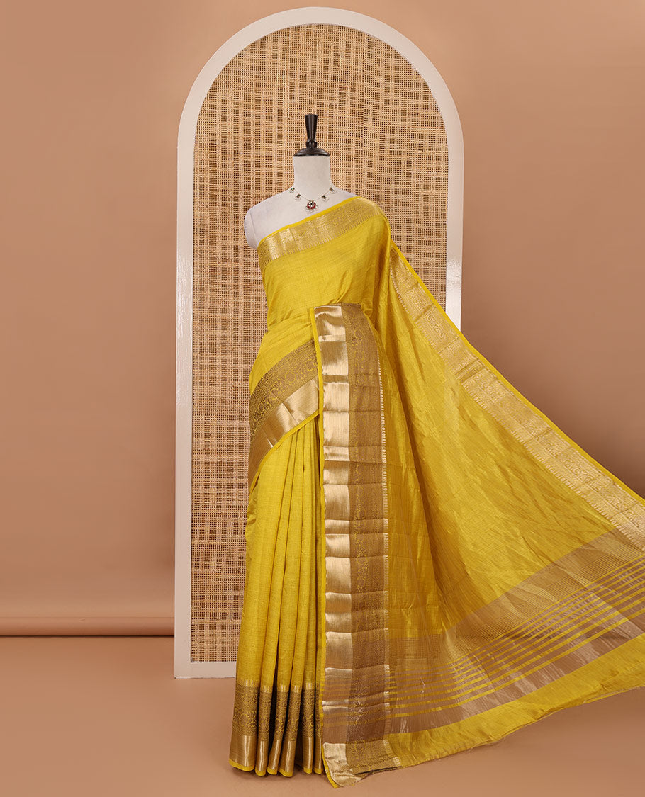 Yellow plain tussar saree, traditional zari design border, pallu of zari stripes & matching traditional motif border blouse
