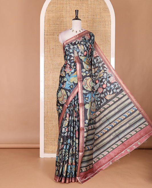 Black-base multi-color kalamkari floral-vine and peacocks printed semi-tussar saree, gold zari piping border, kalamkari printed pallu, and contrast printed blouse